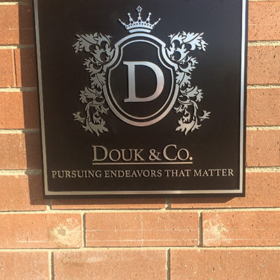 Douk & Co. Custom Exterior Plaque Orange County - Caliber Signs & Imaging in Irvine Call: 949-748-1070