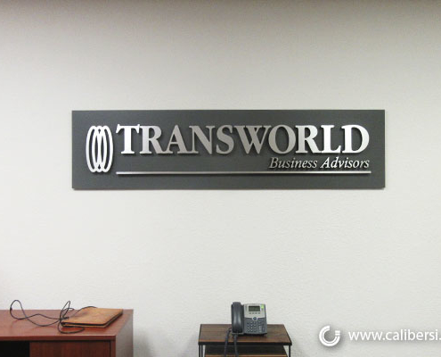 Transworld Brushed Silver Lobby with Acrylic Backer Orange County - Caliber Signs & Imaging in Irvine Call: 949-748-1070